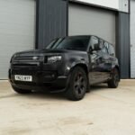 land_rover_defender_l663_90_110_gloss_black_front_rear_corners.jpg